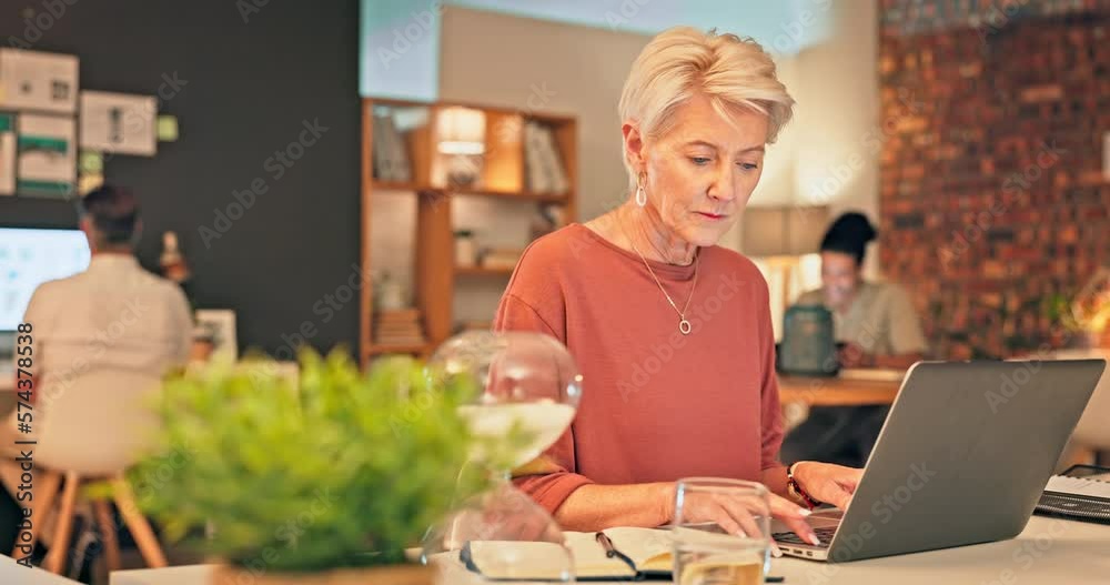 Office, laptop and senior woman typing feedback review of social network, customer experience or e commerce website. Data analytics, research report and media manager doing online survey analysis Office, laptop and senior woman typing feedback review of social network, customer experience or e commerce website. Data analytics, research report and media manager doing online survey analysis