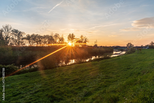 Sunrise with Olse river and sunlights in Karvina city in Czech republic