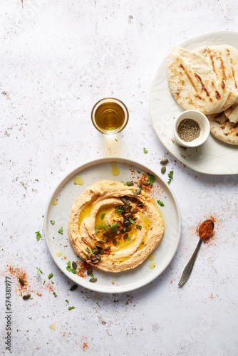 Hummus with flatbreads, olive oil and paprika