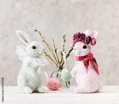 Festive composition with Easter eggs, willow branches and Easter bunny