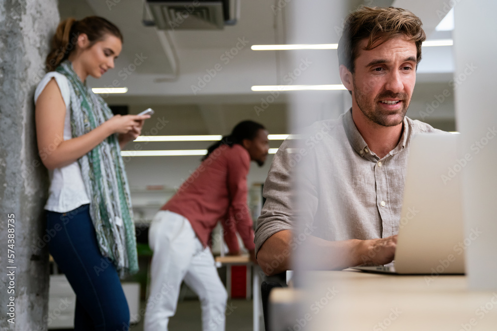 Fototapeta premium Programmers cooperating at IT company developing apps. People business work office concept