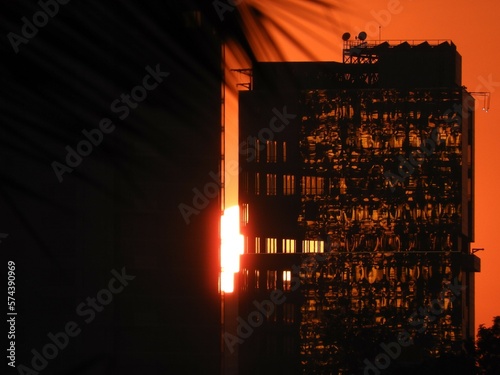Sunlight reflecting off window panes of a building under construction.