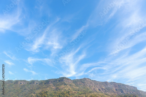 mountain with beautiful clouds and blue sky background