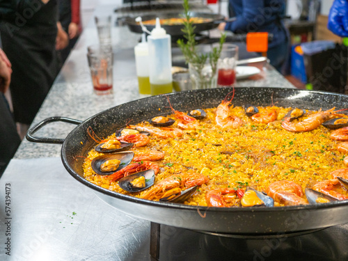 great seafood paella pan with rice, mussels and prawns in cooking class. Traditional Spanish cuisine regional, Valencia.