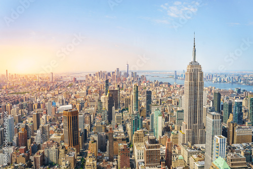 Amazing panorama view of New York city skyline and skyscraper at sunset. Beautiful cityscape in Midtown Manhattan. Copy space for text. © deliris
