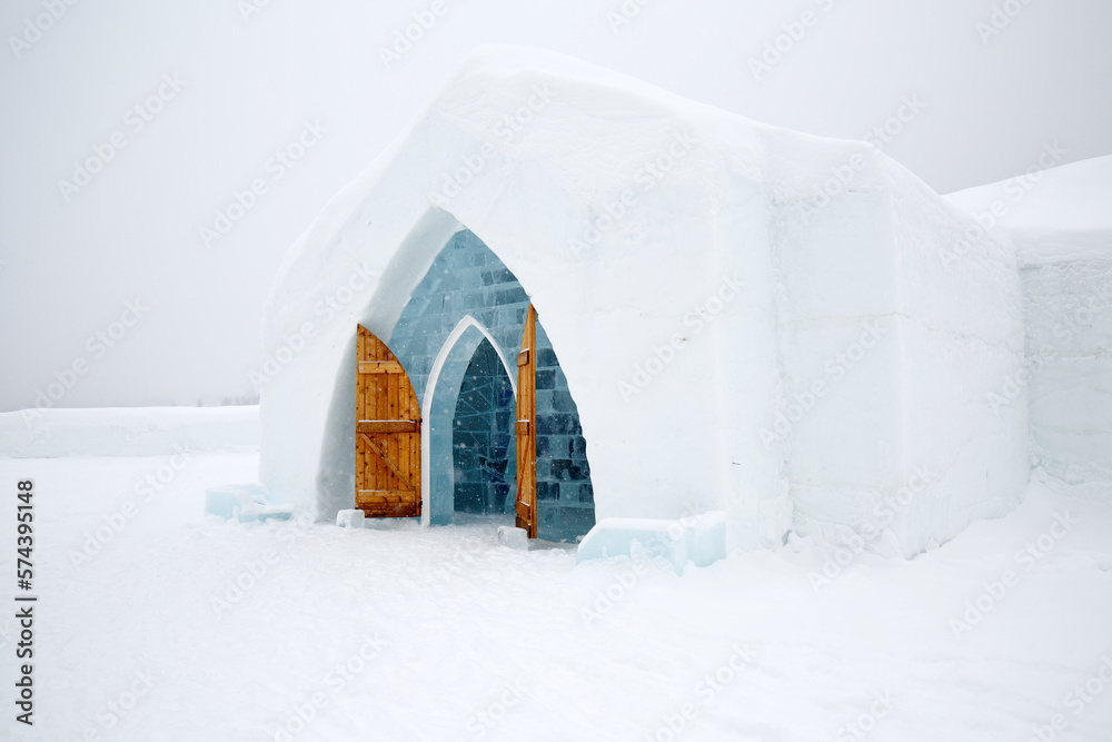 Naklejka premium Quebec, Canada: Made with ice and snow, the Ice Hotel is Quebec's architectural masterpiece each winter, with high ceilings, ice sculptures, and furniture carved from ice blocks.