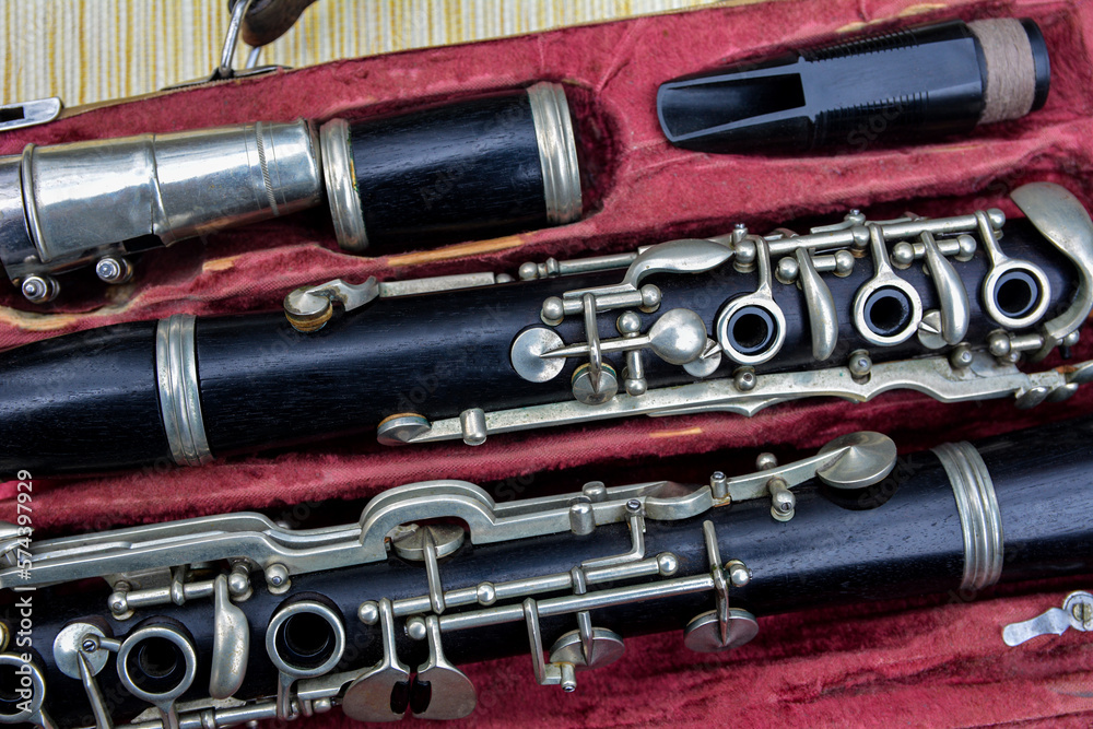 Naklejka premium Disassembled clarinet in its case .