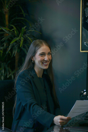 woman with laptop smiling female marketing professional meeting conference room professional content creator smile office life consultant working designer 