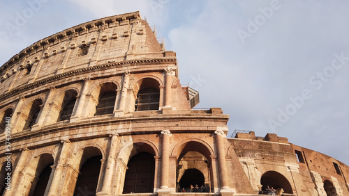 Superposed order of the Colosseum in Rome, Italy. The ancient Roman Colosseum is one of the main tourist attractions in Europe. photo