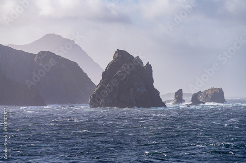 Jagged rocky outcroppings off Hornos Island near Cape Horn in Chile photo