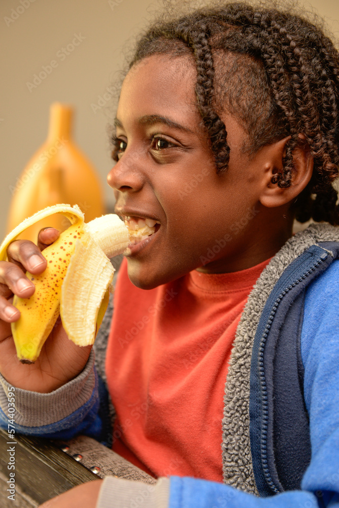 Child Eating Banana Stock Photo Adobe Stock