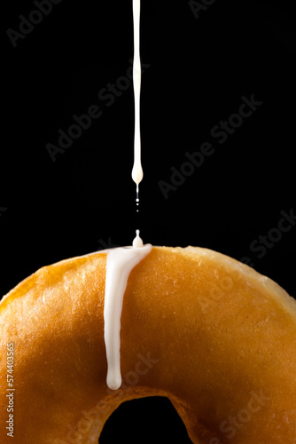 Delicious doughnut poured with sugar icing