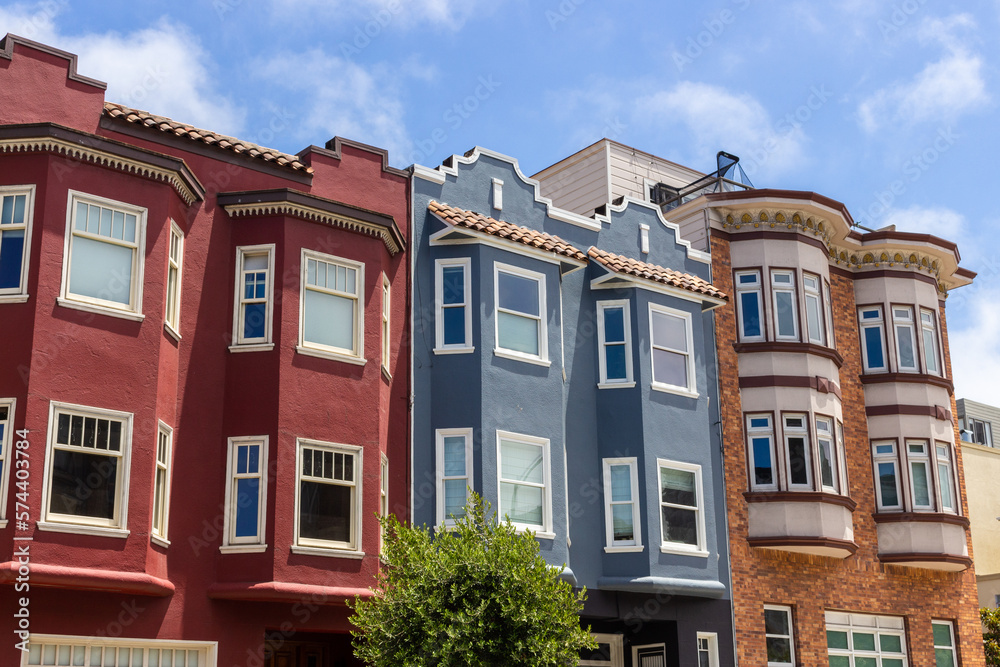 San Francisco, California, USA, June 29, 2022: San Francisco Victorian houses near Washington Square. - obrazy, fototapety, plakaty 
