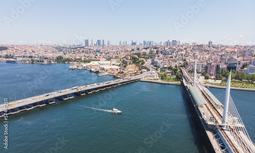 Top view of the city of Istanbul and the Bosphorus, in the foreground a bridge, on a warm summer day © Denis