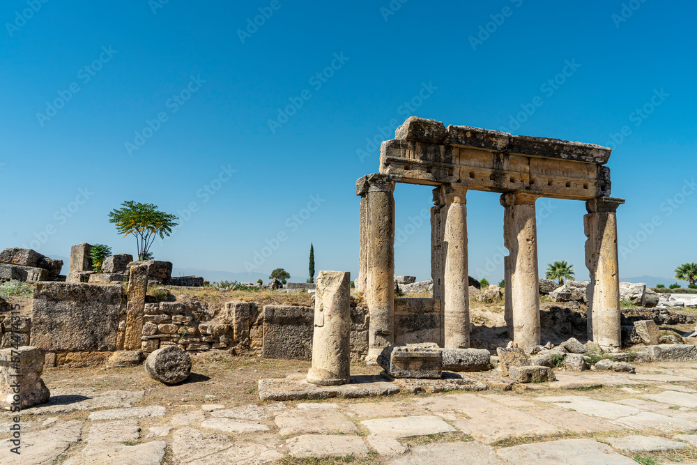 Colonnade street or the main street of ancient ruined city Hierapolis in Pamukkale, Denizli, Turkey. Copy space for text.