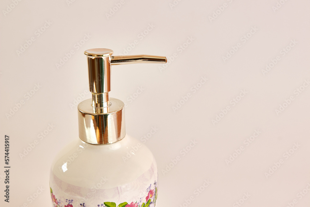 Obraz premium Ceramic bottle with liquid soap. Washing hands. Hygiene concept.