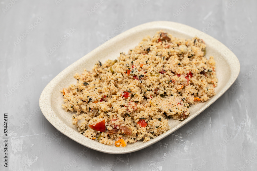 Couscous with vegetables in a dish on ceramic Couscous with vegetables in a dish on ceramic