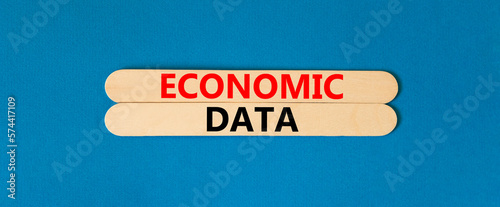 Economic data symbol. Concept words Economic data on wooden sticks. Beautiful blue table blue background. Business economic data concept. Copy space.