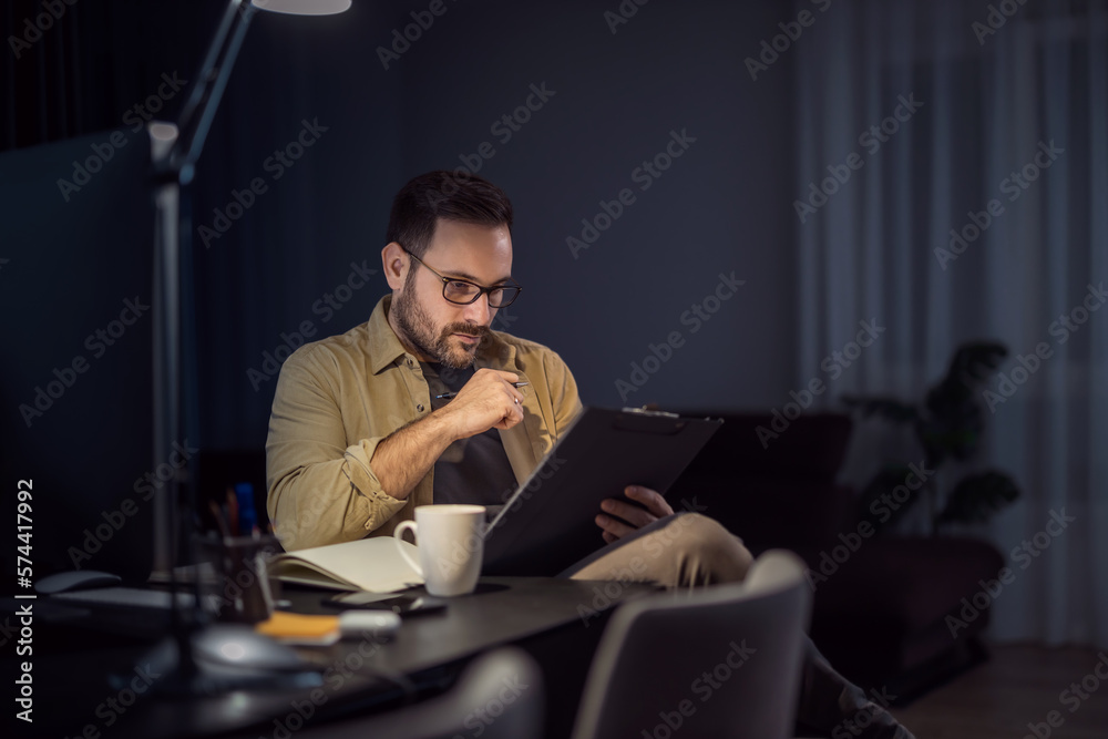 Male designer working at home office on new ideas