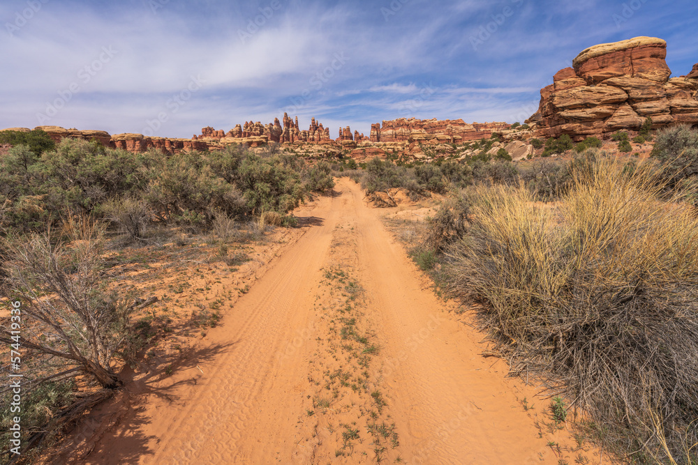 hiking the chesler park loop trail in the needles in canyonlands national park, usa