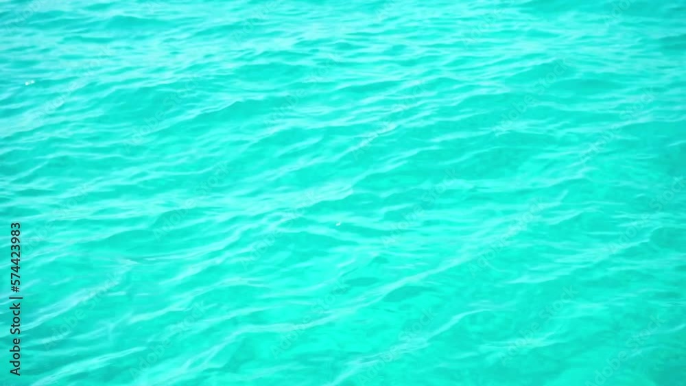 Pool water ripples and the reflection of the sun. Waves, movement of azure sea, ocean water with rays of the sun. Water abstract background. High quality FullHD footage Pool water ripples and the reflection of the sun. Waves, movement of azure sea, ocean water with rays of the sun. Water abstract background. High quality FullHD footage