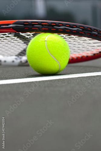 Tennis Balls and Racket © Grindstone Media Grp