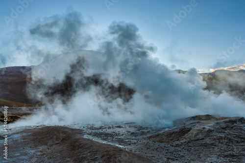 Steaming vent on the El Tatio geyser field in the high Andes of northern Chile in the blue hour before sunrise 