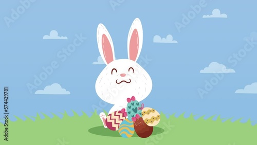 spring eggs painted with bunny in landscape