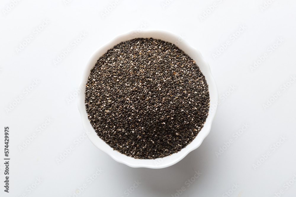 Chia seeds in bowl on colored background. Healthy Salvia hispanica in small bowl. Healthy superfood Chia seeds in bowl on colored background. Healthy Salvia hispanica in small bowl. Healthy superfood