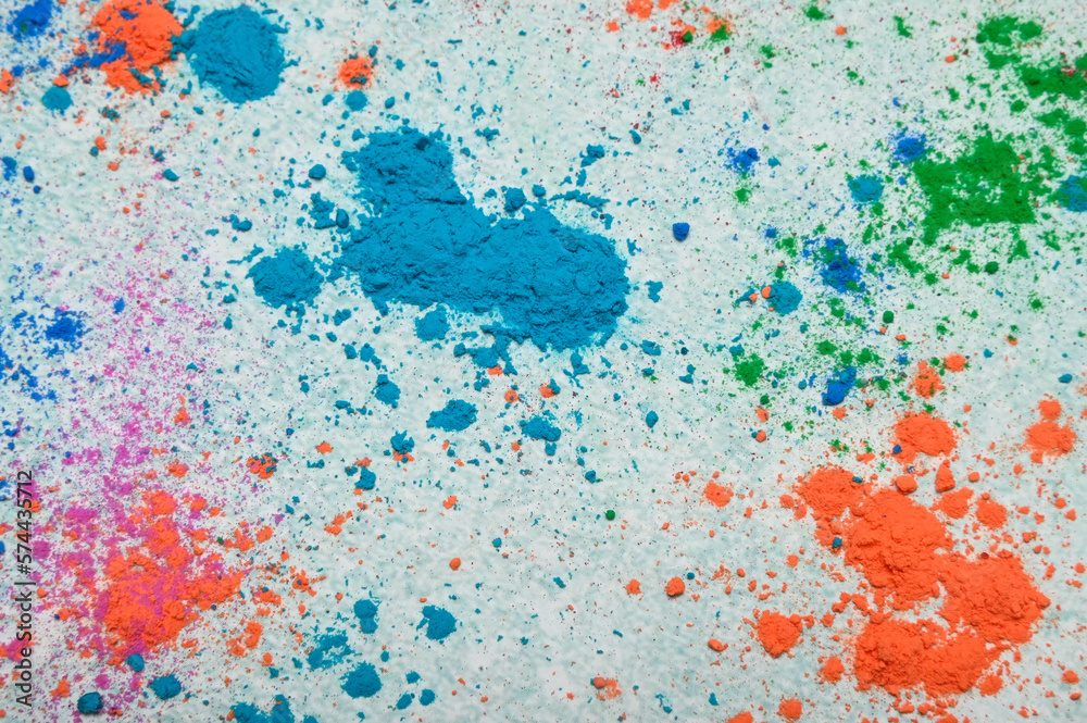 top view of colorful traditional holi powder in bowls isolated on dark background.Space for text . happy holi.Concept Indian color festival called Holi