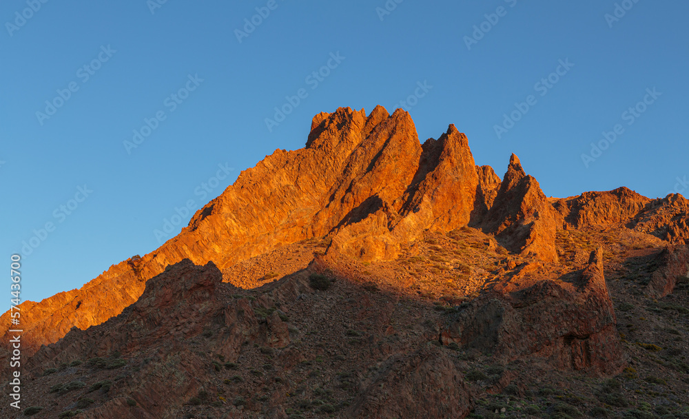 Jagged volcanic rock formations in the caldera of the El Teide volcano at sunset, Tenerife, Spain
