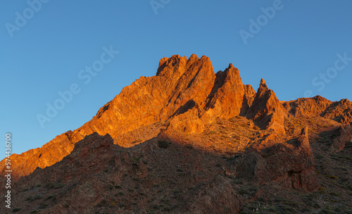 Jagged volcanic rock formations in the caldera of the El Teide volcano at sunset, Tenerife, Spain 