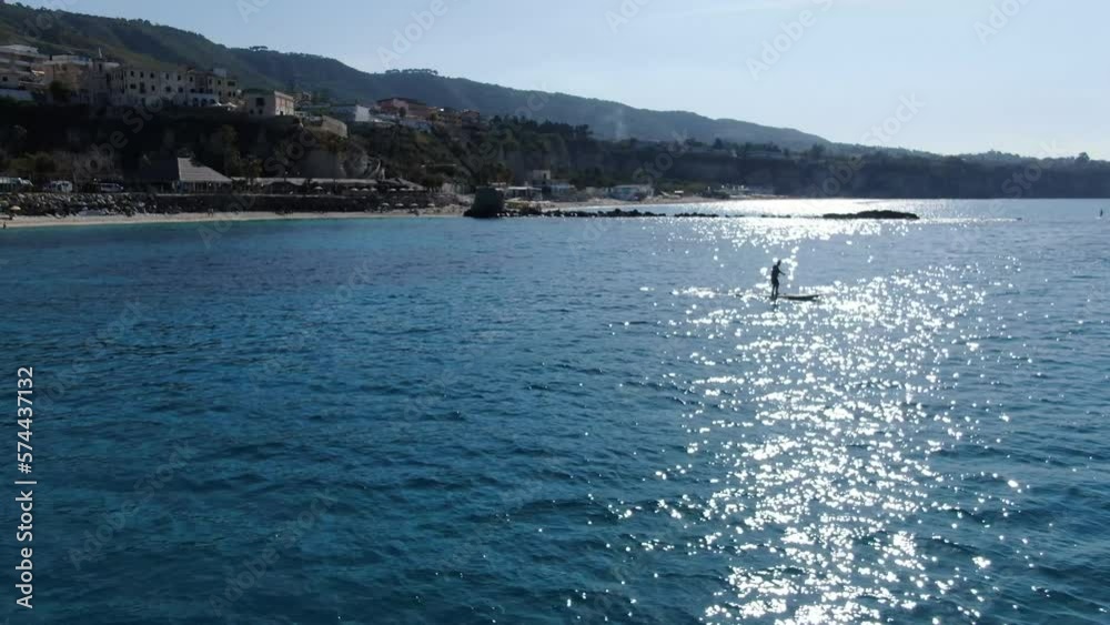 Drone shot of paddle boarder on the Mediterranean sea Drone shot of paddle boarder on the Mediterranean sea