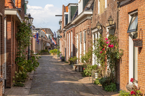 Narrow street in the center of the picturesque village of Woudsen in the province of Friesland  Netherlands.