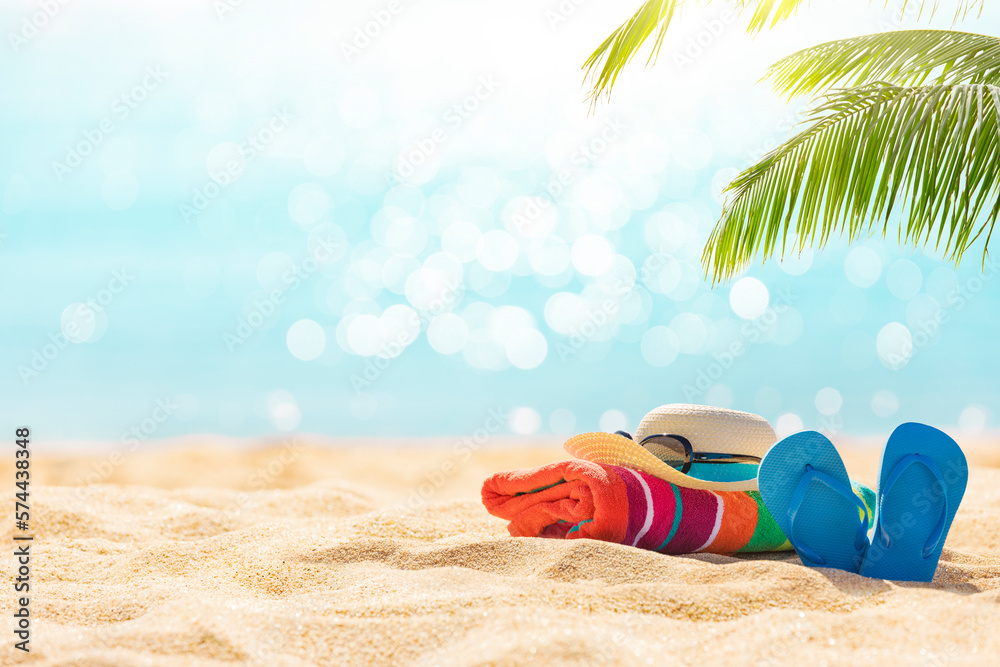 Summer holiday background with flip flops and palm tree on sandy beach - obrazy, fototapety, plakaty 