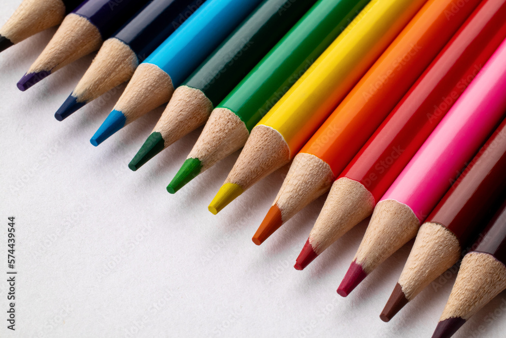 Bright сolored pencils on a white paper background. Blots. Rainbow. Close up. Macro. Bright сolored pencils on a white paper background. Blots. Rainbow. Close up. Macro.