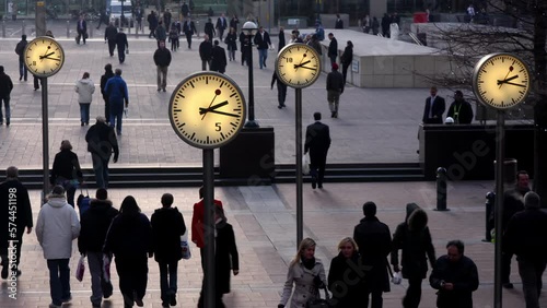 London docklands clocks with people photo