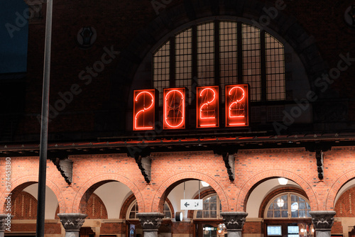 Obraz na płótnie illuminated clock at night at main train station in Copenhagen, Denmark w salonie