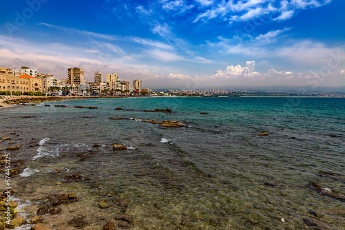 Obraz na płótnie Lebanon. Tyre (UNESCO World Heritage Site), Al Mina Archeological Site. Egyptian harbor - the remains of mole and sunken ancient columns. There is a modern city in the background w salonie