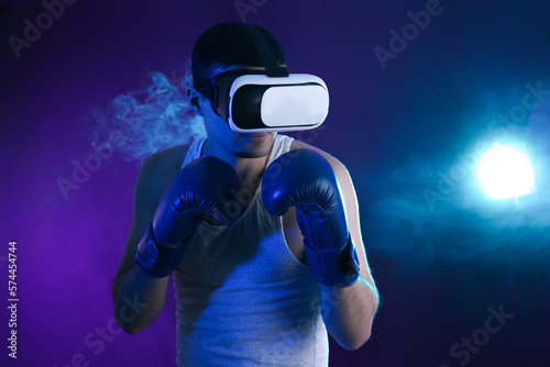 Young man with VR glasses a...
