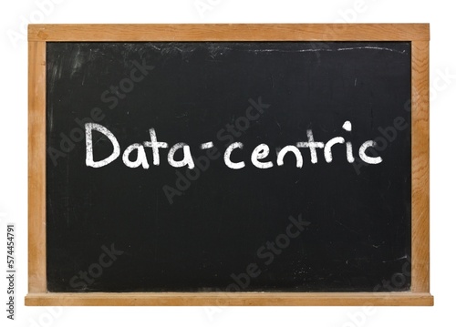 Data-centric written in white chalk on a black chalkboard isolated on white