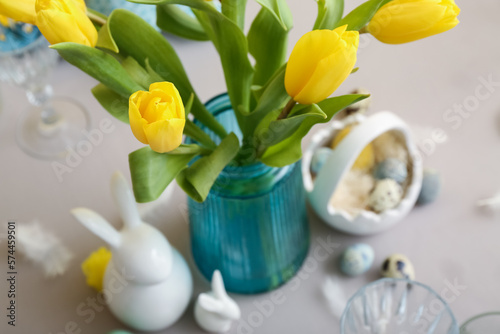 Yellow tulips in blue vase ...