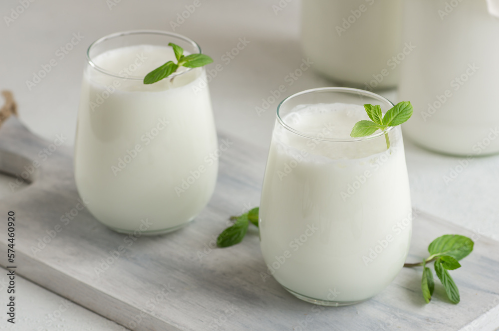 Glass cup of Turkish traditional drink ayran , kefir or buttermilk made from yogurt, healthy food Glass cup of Turkish traditional drink ayran , kefir or buttermilk made from yogurt, healthy food