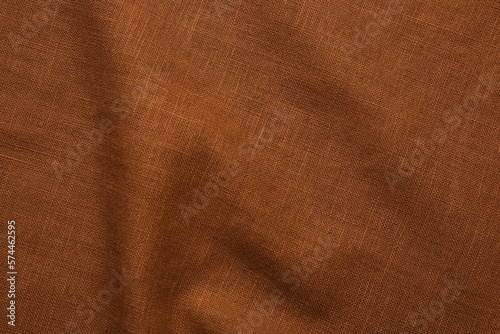Closeup view of crumpled brown fabric as background