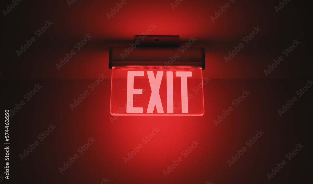 Hallway exit sign vibrant in corridor showing evacuation during emergency neon - obrazy, fototapety, plakaty 