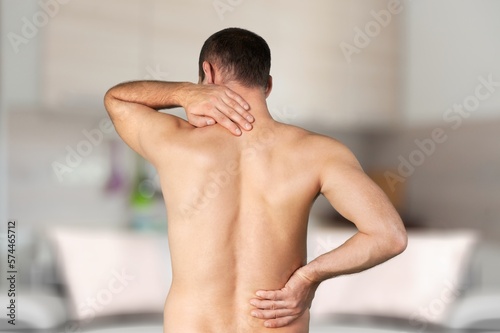 Sad man feel pain on his back