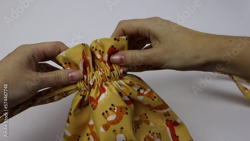 Hobby sewing on a sewing machine. The tailor cuts out the details of the product and sews. The girl is engaged in needlework, creativity.