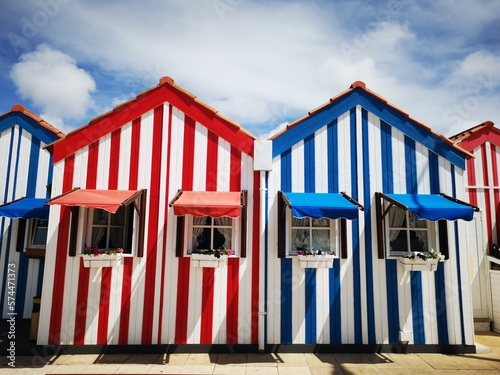 Colourful striped houses in Costa Nova, a sunny summer day in Portugal 