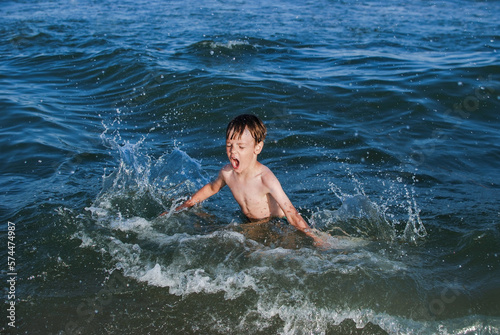 swim, learn to swim, child laughs, waves, splashes, ocean, danger on water © ArtifexDi