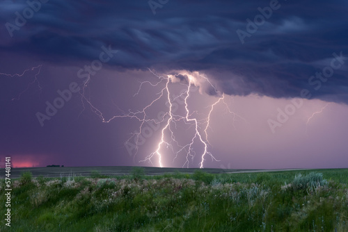 Lightning strikes in a thunderstorm over a field